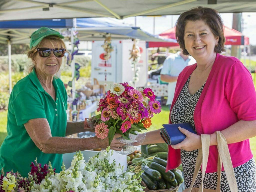 selling flowers at Bermagui Growers and makers market