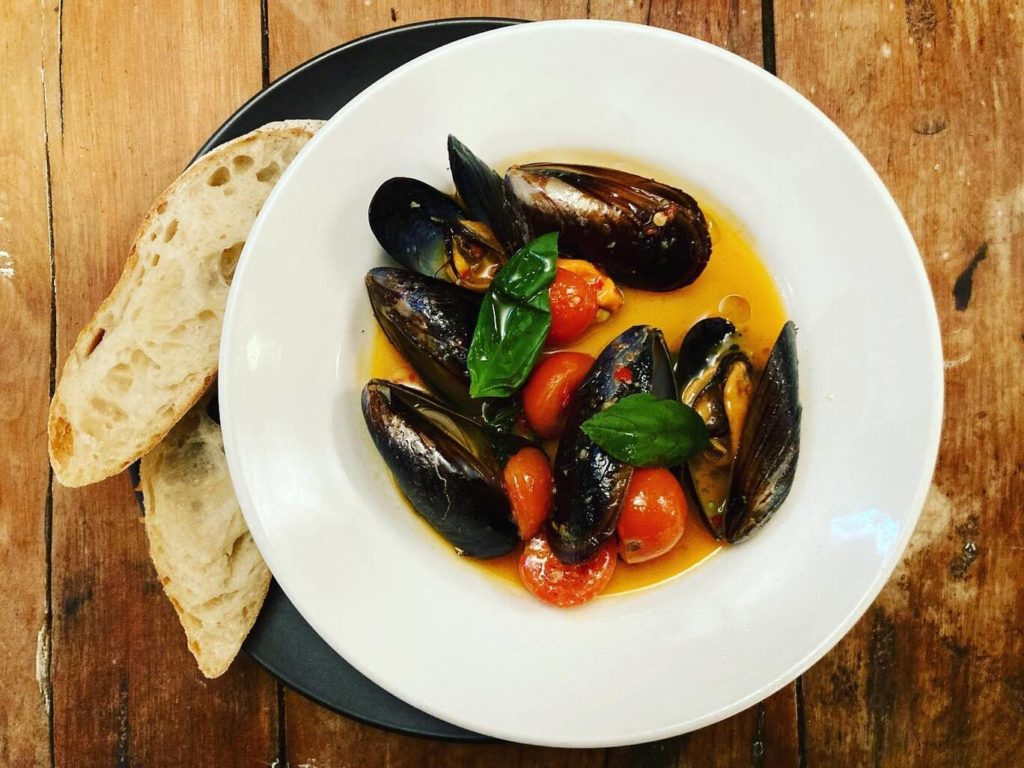 Mussels cooked in cherry tomatoes