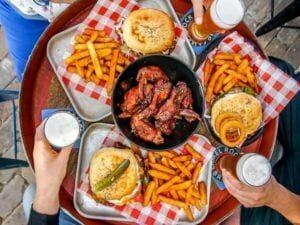 Friends eating Burger Fires, Wings, and Beer ar Camel Rock Brewery, Bar and Grill