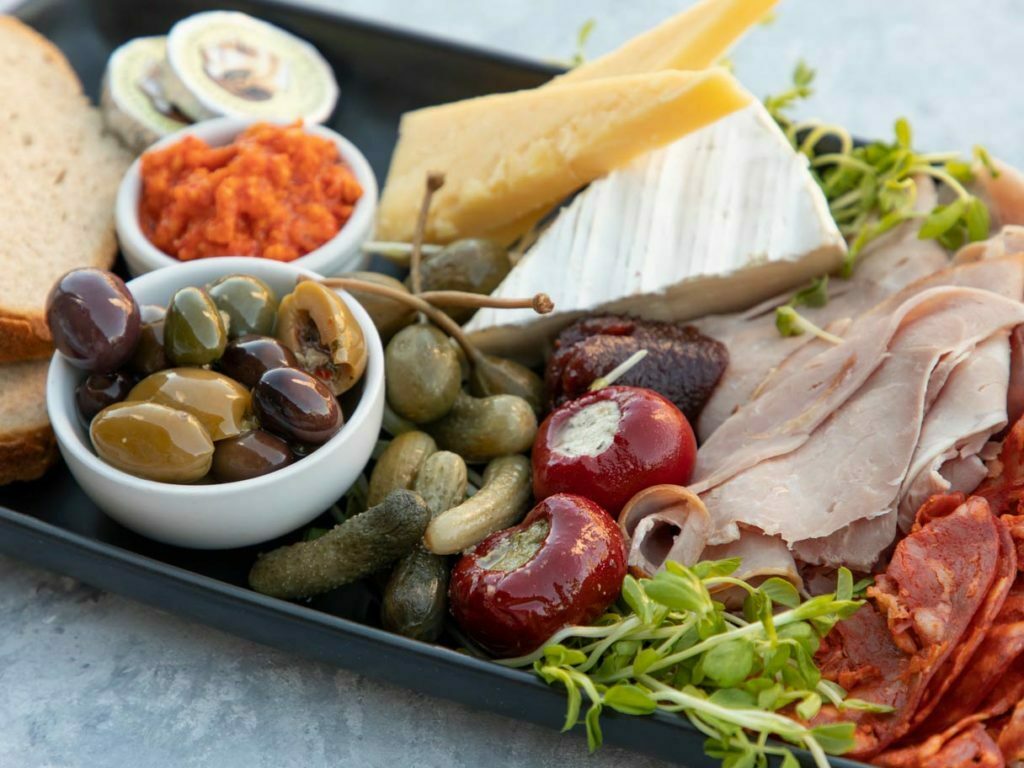 charcuterie on a black tray