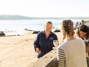 woman serving oyster at broadwater oysyters