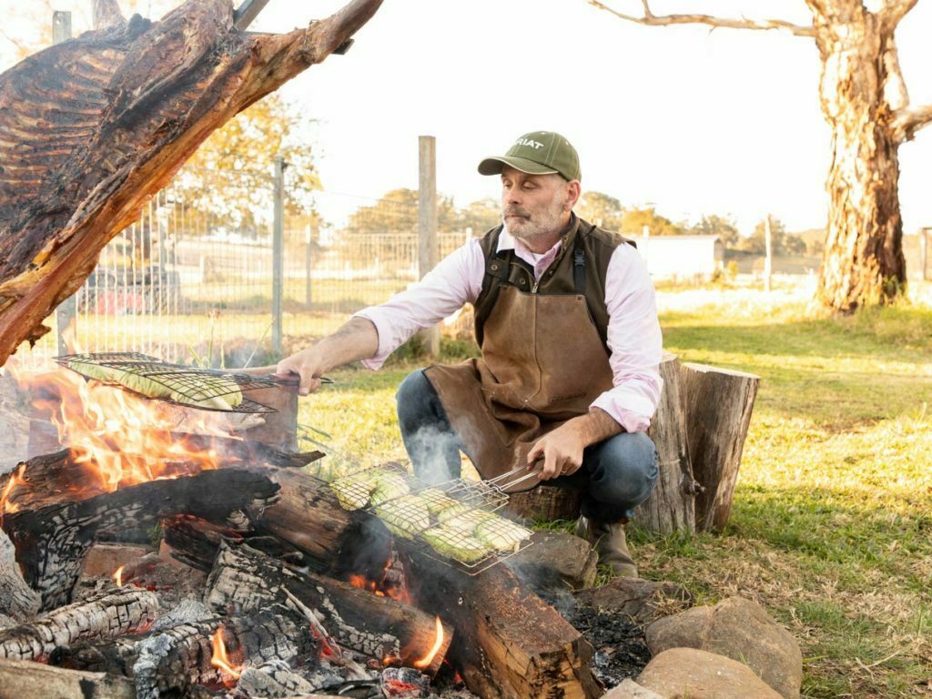 man grilling at millford acres farm
