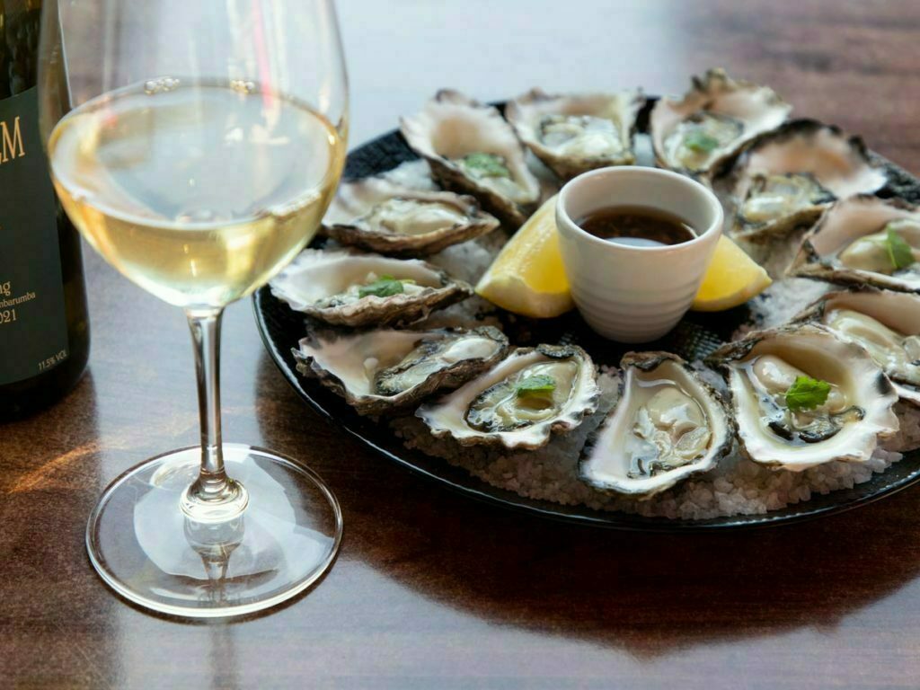 Freshly served oyster with wine